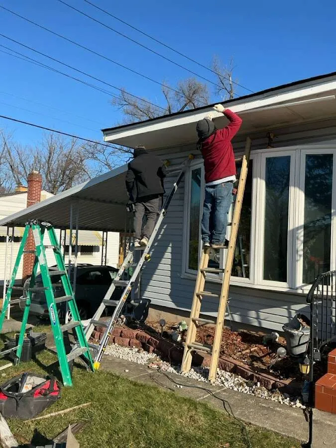 Restoration crew performing exterior repair in Chenango